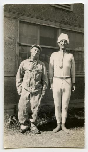 [Two Soldiers Standing Behind a Building]