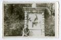 Photograph: [A Soldier Standing in Front of a Monument]