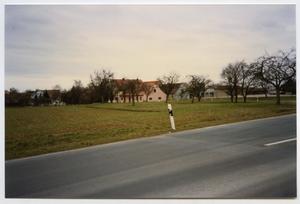 Primary view of object titled '[Looking at Houses Along the Road]'.
