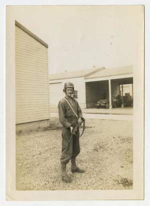 [Man Wearing Helmet and Holding Rifle]