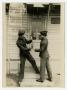 Photograph: [Men Staging Charade Fight]