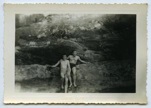 [Two Men Sitting on the Rocks]