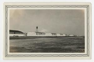 Primary view of object titled '[Photograph of a Line of Aircraft Hangars at Kelly Field]'.
