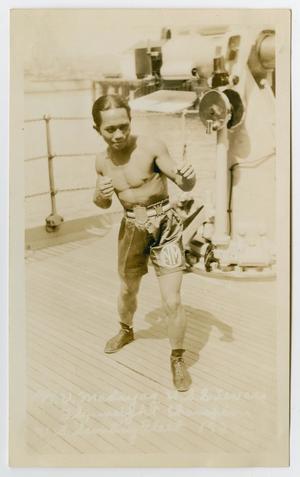 Primary view of object titled '[Photograph of a Boxer on Board the U.S.S. Texas]'.
