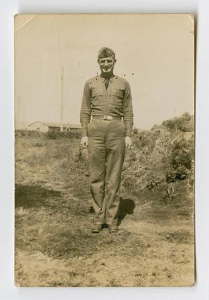 [Photograph of a Uniformed Soldier in a Field]