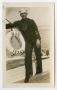 Photograph: [Photograph of a Sailor Standing on the U.S.S. Texas]