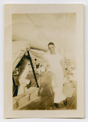[Photograph of a Sailor Leaning on a Hatch Door]