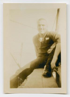 [Photograph of a Sailor Sitting Down on the U.S.S. Texas]