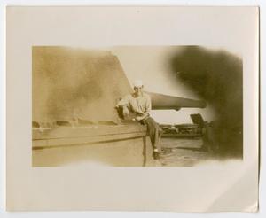 [Photograph of a Sailor Sitting on a Gun Turret]