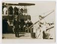 Photograph: [Photograph of a Captain W. G. Assetson Greeting Crew]