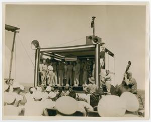 [Photograph of a Group of People Singing]