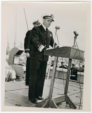 [Photograph of a Navy Officer Giving a Speech]