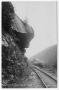 Postcard: [Postcard of Hanging Rock Over Railroad Track]