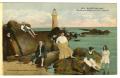 Postcard: [Postcard of People Standing and Sitting on Rocks Near Lighthouse]