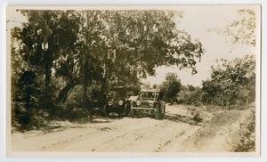 [Two Cars near the Brazos River]