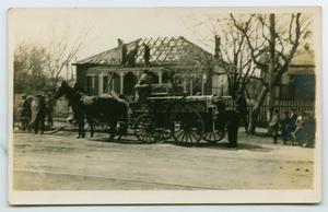 [Postcard with a Photo of a Fire Wagon by a Damaged Home]