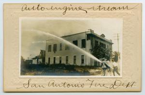 Primary view of object titled '[Postcard with a Photograph of Firemen Working a Fire Hose]'.