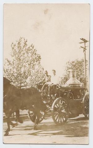 [Postcard with a Photograph of Two Firemen on a Steamer Engine]
