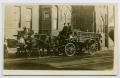 Postcard: [Postcard with a Photograph a Horse-Drawn Fire Wagon Rolling Down a S…