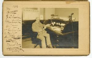 Primary view of object titled '[Photograph of James Lewis Caldwell at His Desk]'.