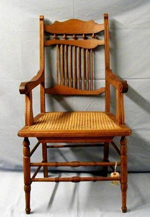 [Stick and ball oak chair with arms]