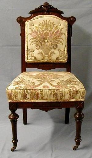 [Silk cream-colored parlor chair, legs slightly crooked]