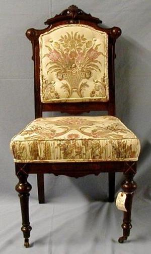 [Silk cream-colored parlor chair, legs slightly turned inward]