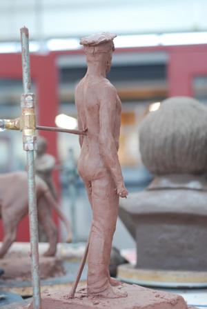 Primary view of object titled '[Mini Sculpture of a Man Wearing a Hat]'.