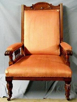 [Eastlake golden oak armchair with orange fabric, torn corner]
