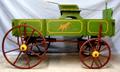 Primary view of [Green painted express wagon with red wheels]