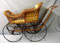 Physical Object: [Wicker Baby carriage, gold fabric-lined interior]