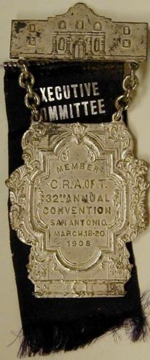 Primary view of object titled '[Two tiered San Antonio livestock pin and purple executive committee ribbon]'.