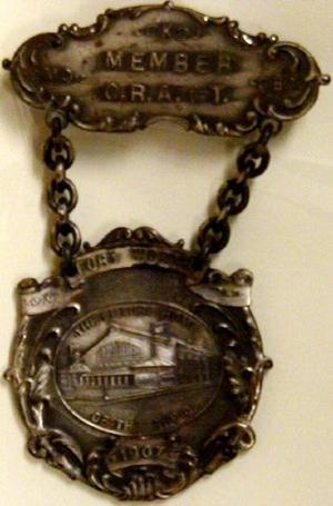 [Two pieces medals connected by chain that reads: "MEMBER C.R.A. OF T." on top]
