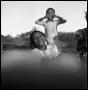 Photograph: [Three Young Children Smiling and Playing]