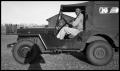 Photograph: [Man in a Jeep]