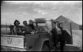 Photograph: [Family Members Posing in Pick-up Truck]
