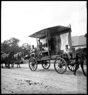 Primary view of object titled '[Medicine Show Wagon on Road]'.