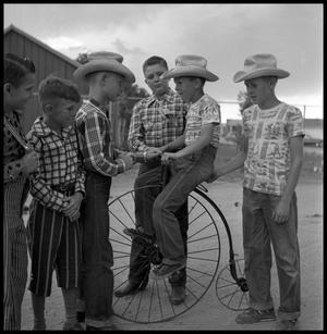 Primary view of object titled '[Boys with a Penny-Farthing Bicycle]'.