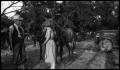 Photograph: [Old Man and a Young Woman with Horses]