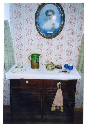 Primary view of object titled '[Photograph of a Kitchen Cabinet in the Pound House]'.