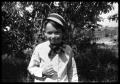 Photograph: [Boy Standing by a Tree]
