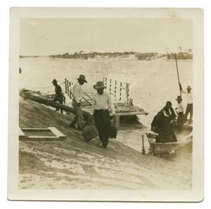 Primary view of object titled '[Photograph of People by Shore]'.