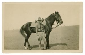 Primary view of object titled '[Photograph of Soldier Standing by Horse]'.