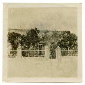 [Photograph of Building with Fence]