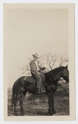 Primary view of object titled '[Photograph of a Man Riding a Horse]'.