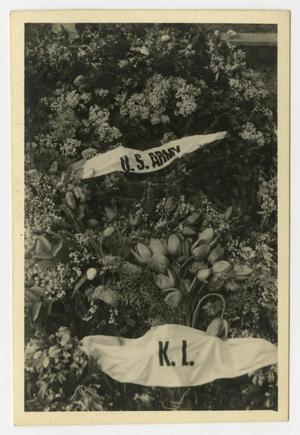 [Photograph of Flowers with Banners on Them]