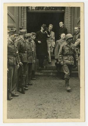 [Photograph of Soldiers Escorting Men out of a Building]