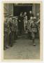 Photograph: [Photograph of Soldiers Escorting Men out of a Building]