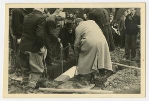 [Photograph of a French Casket Being Lowered into the Ground]
