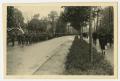 Photograph: [Photograph Allied Troops Marching Down a Street]